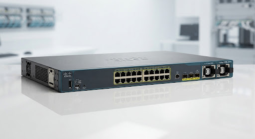 Cisco Catalyst 9200L 24 port compact access tier switch hardware presentation on clean reflective surface